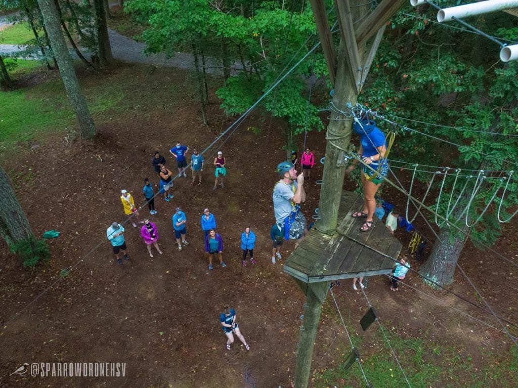 a group of people flying a kite