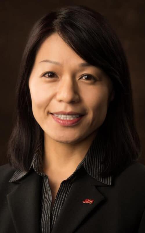 a woman who is smiling and looking at the camera