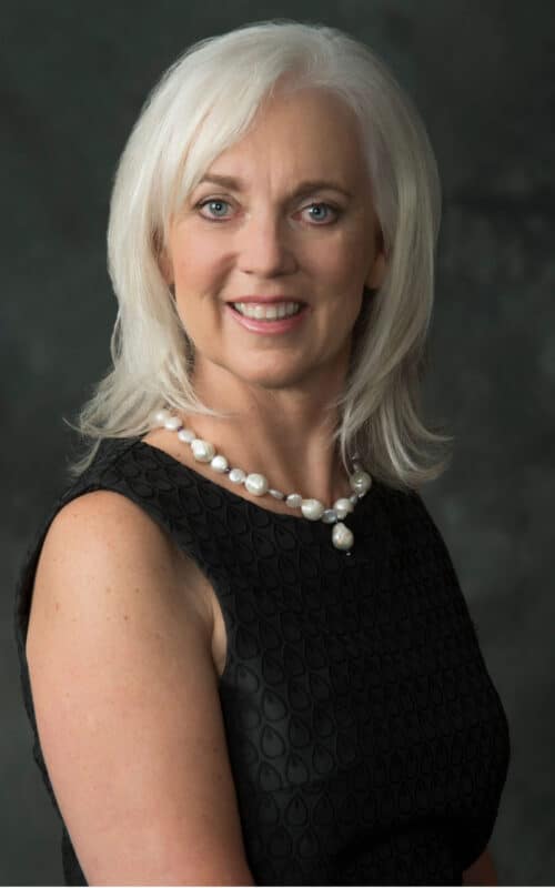 a woman who is smiling and looking at the camera