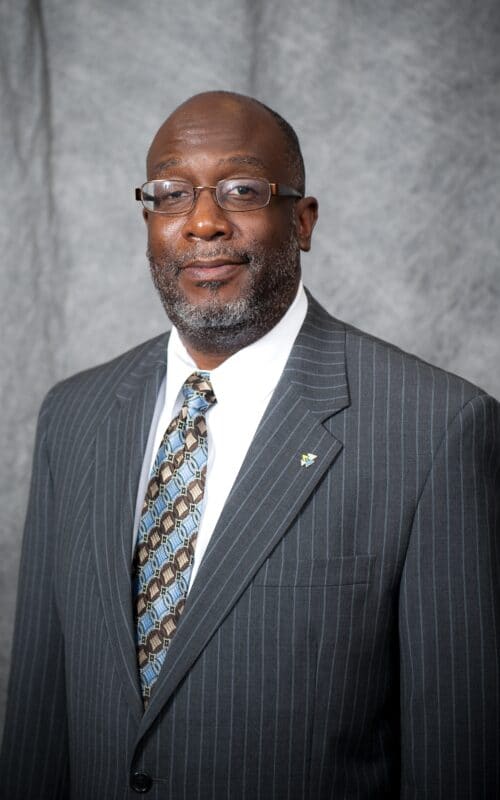 Victor Brown wearing a suit and tie