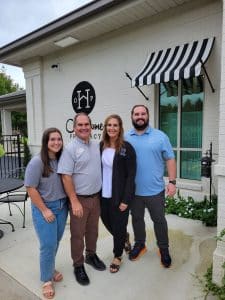a group of people standing in front of a building