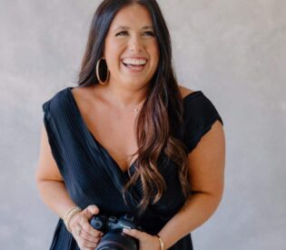 A Woman Holding A Camera