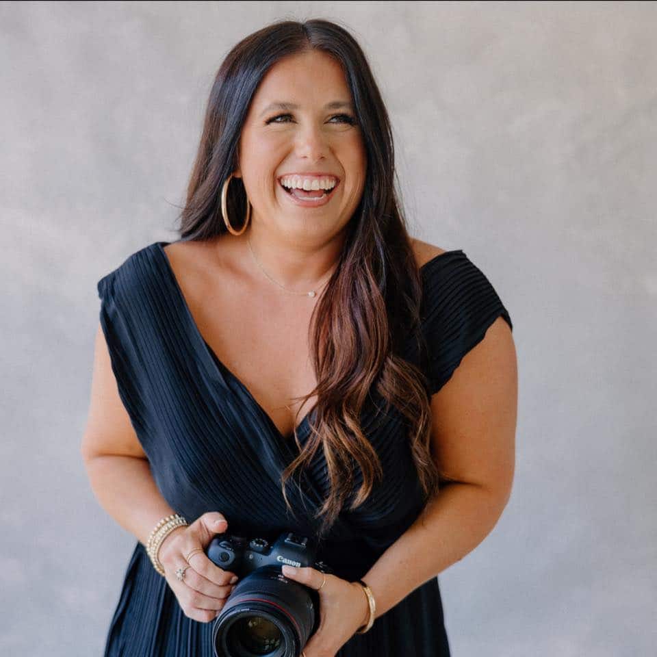 a woman holding a camera