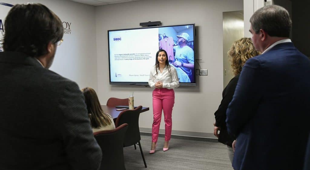 a group of people standing in a room