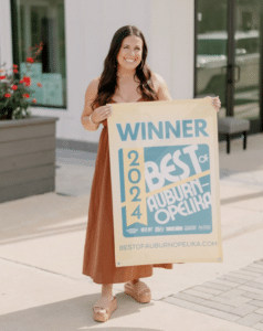 a woman holding a sign