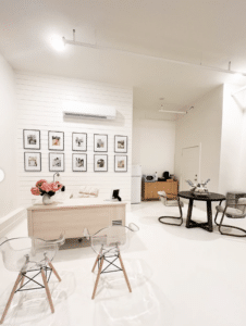 a room filled with furniture and a mirror